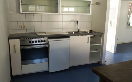 Wohnhaus mit Ladeneinheit in der Stadtmitte